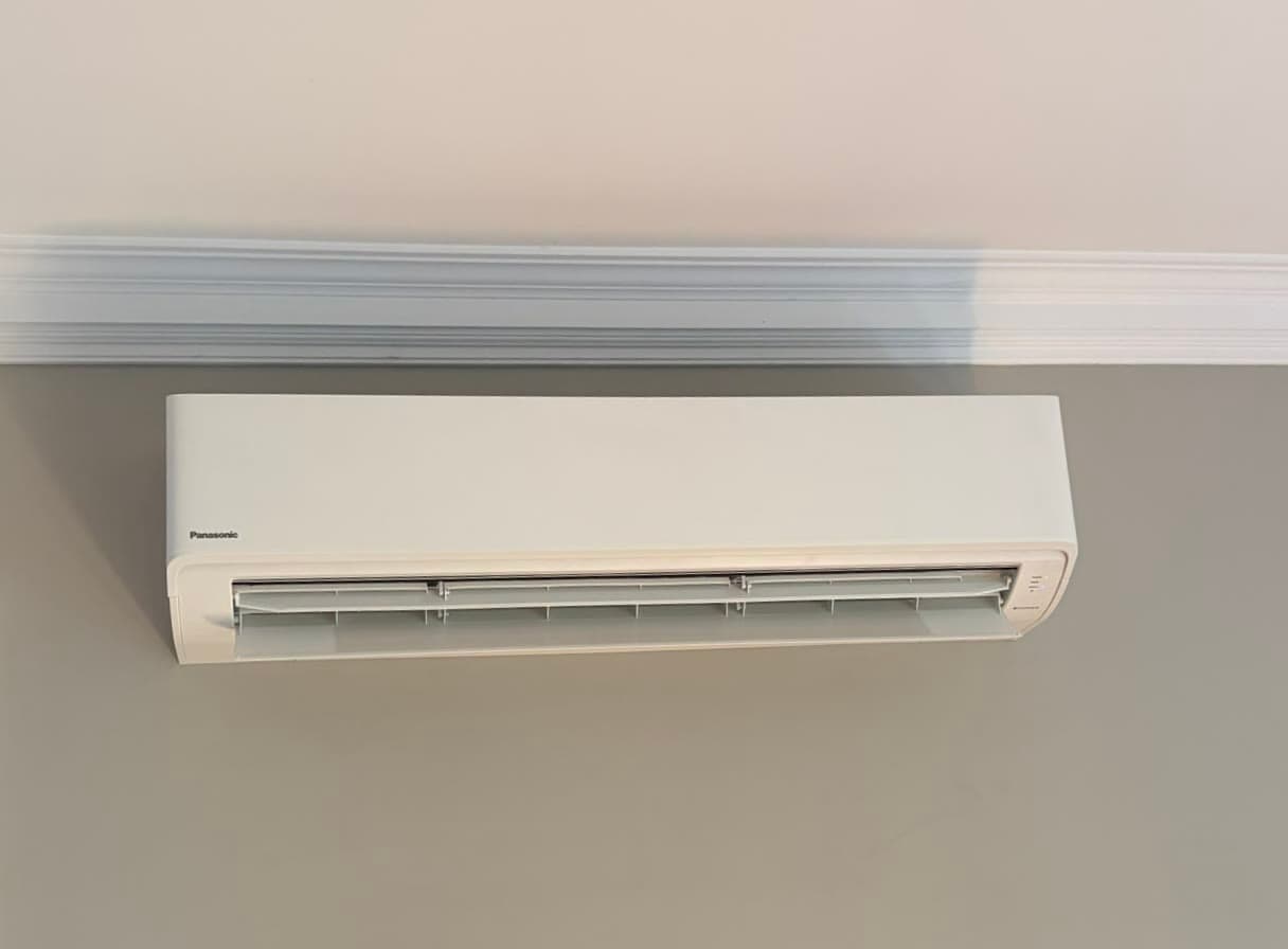 A split system on a living room wall, our previous work