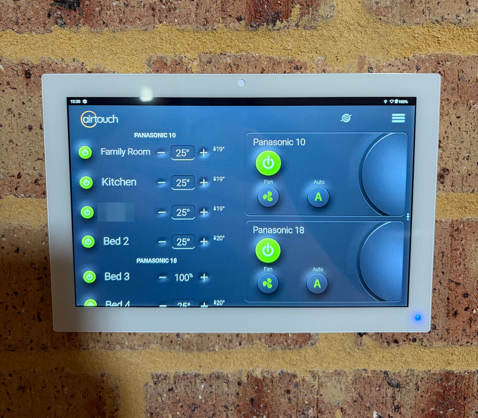 An AirTouch zone controller on a face brick wall, our previous work