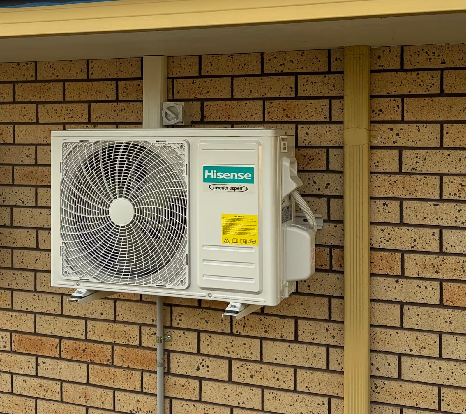 A split system outdoor unit on wall brackets, our previous work